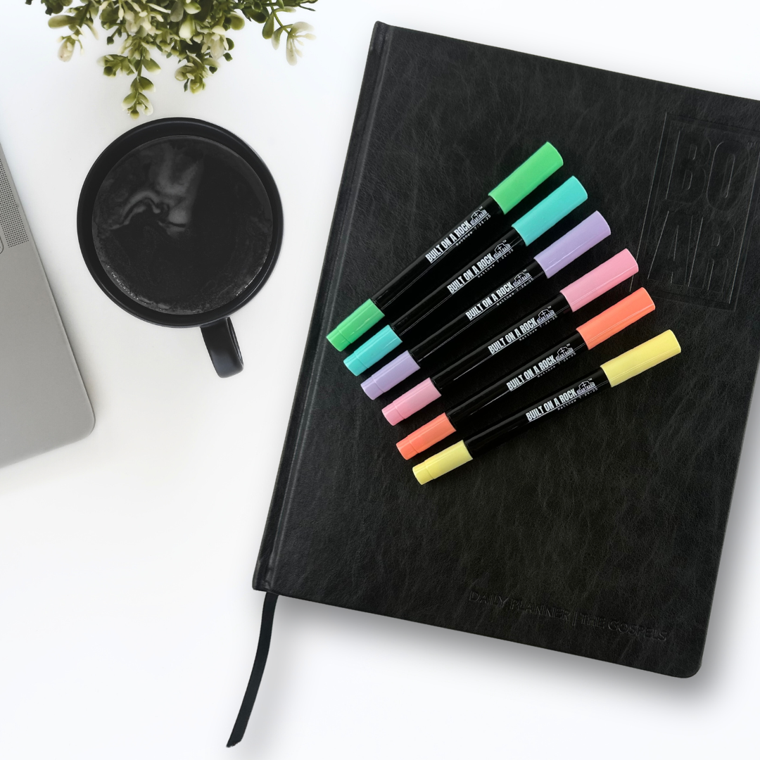 Planner with pens on top